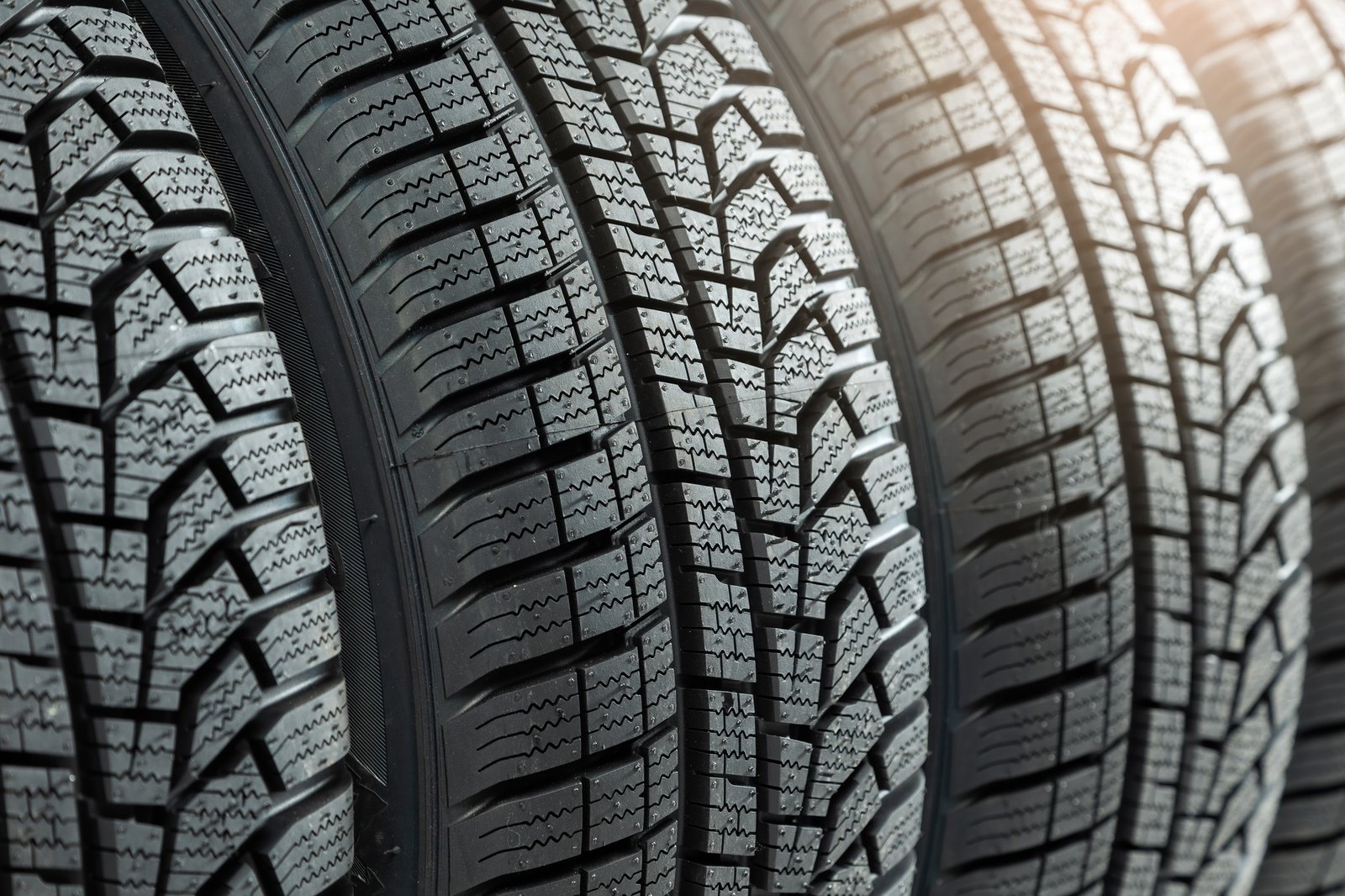 Detail of new winter tires for car with deep rubber patter to increase adhesion