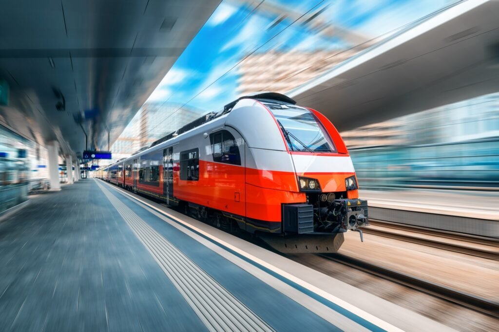 High speed train in motion on the train station at sunset